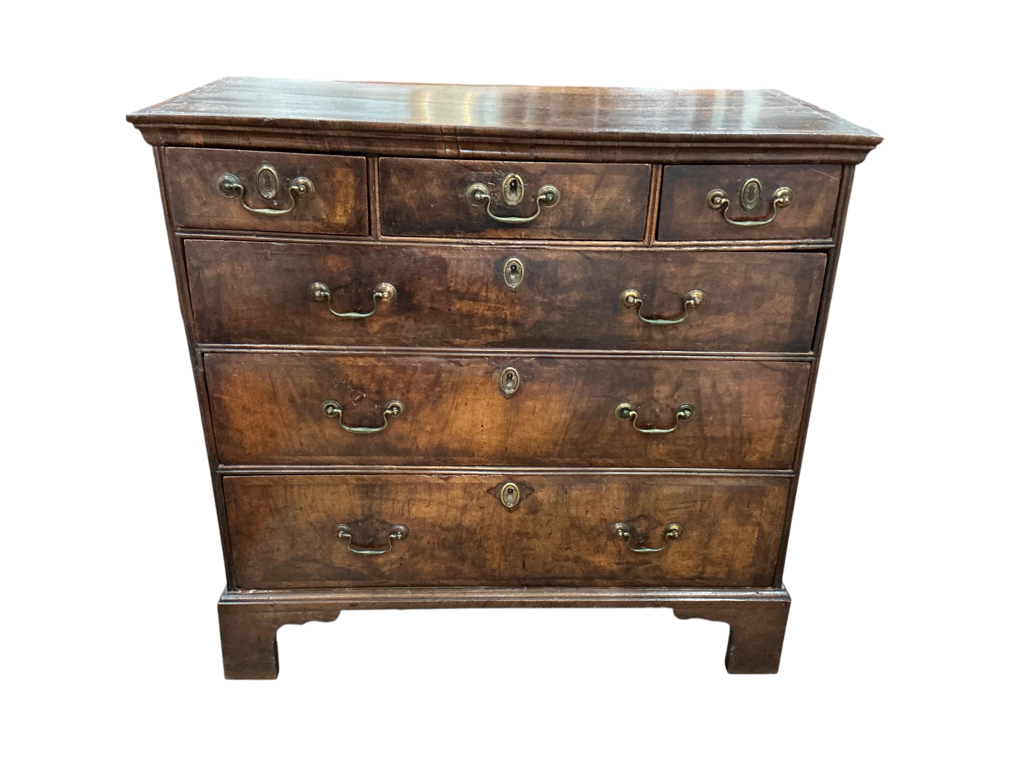 An 18th century oak and walnut chest, width 98cm, depth 49cm, height 94cm
